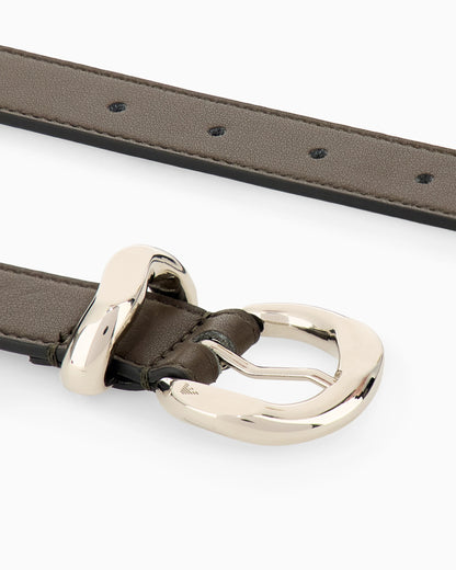 Leather tongue belt with a polished metal buckle