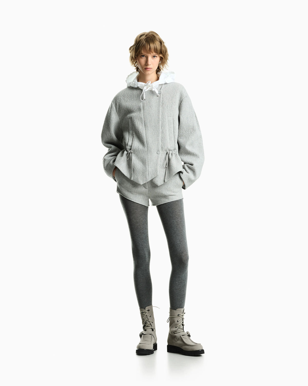 Wool seersucker blouson with a drawstring hood and pockets