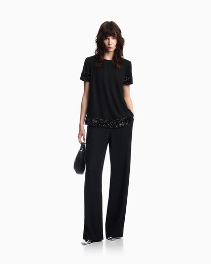 Wide-leg trousers in mixed wool with metallic side studs