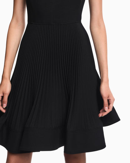 Dress in technical fabric with a pleated skirt