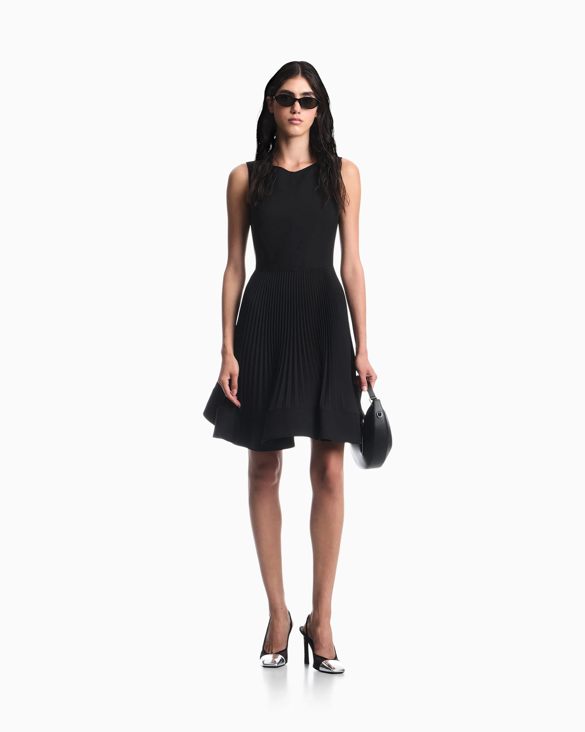 Dress in technical fabric with a pleated skirt