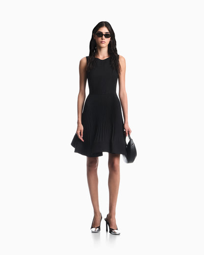 Dress in technical fabric with a pleated skirt