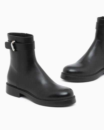 Leather ankle boots with side zip and buckled strap