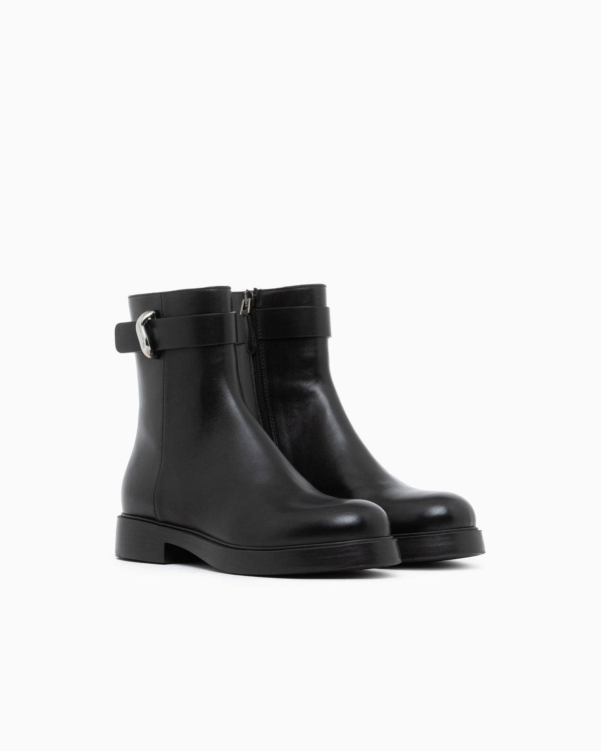 Leather ankle boots with side zip and buckled strap