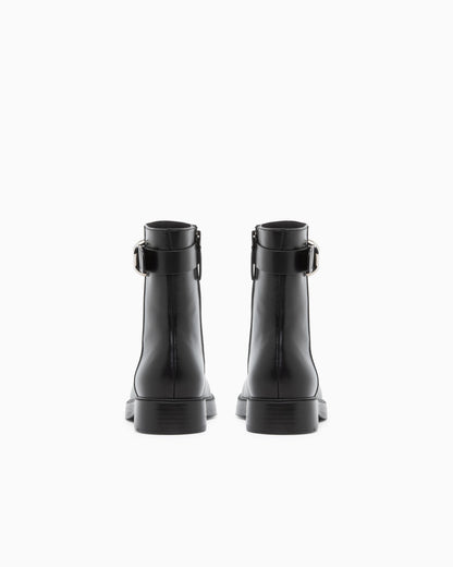 Leather ankle boots with side zip and buckled strap