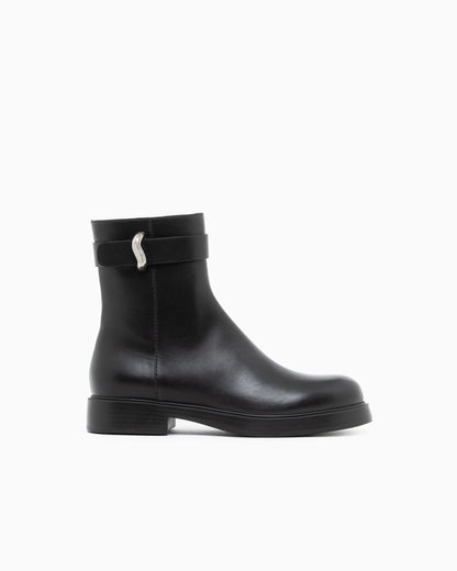 Leather ankle boots with side zip and buckled strap