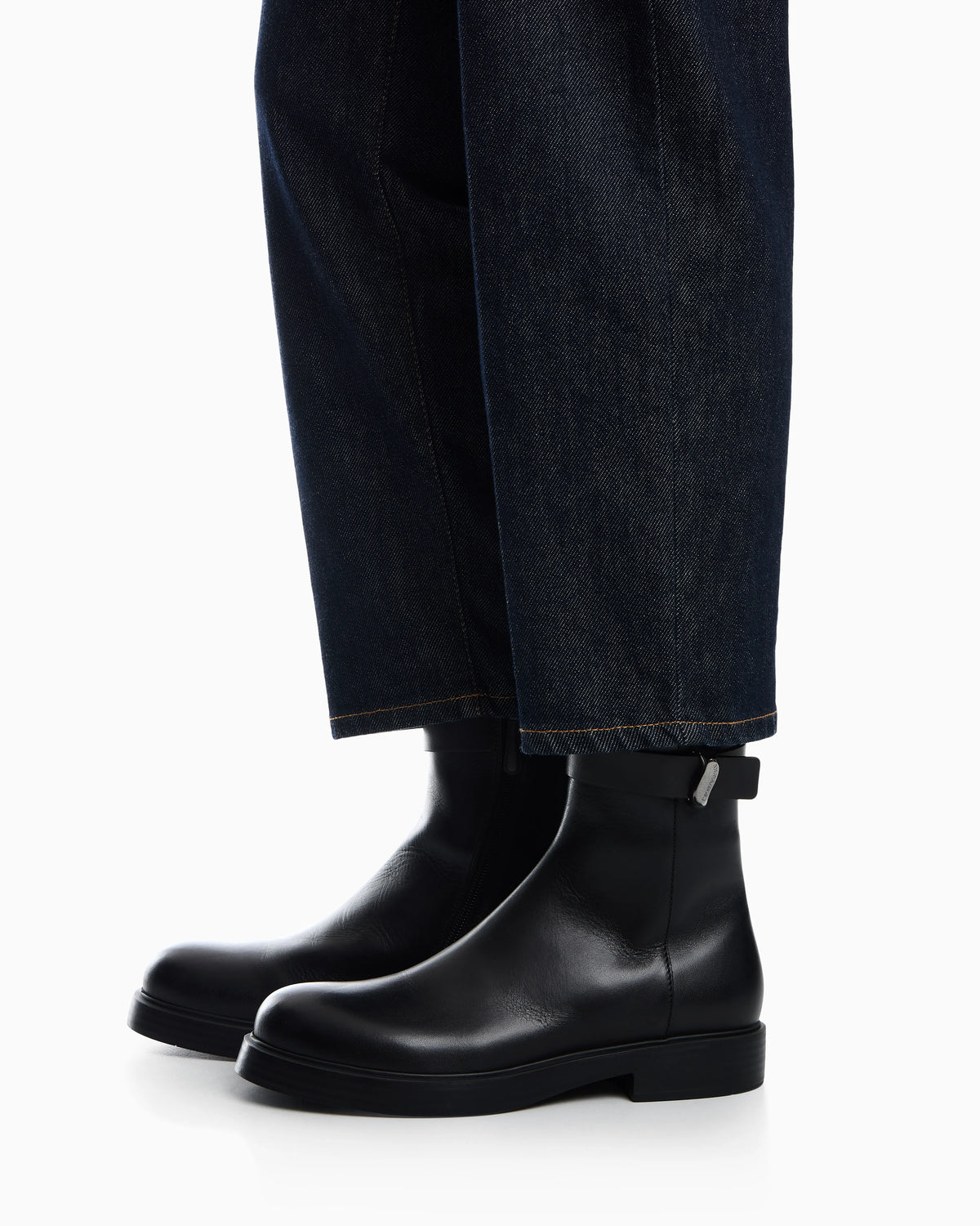 Leather ankle boots with side zip and buckled strap