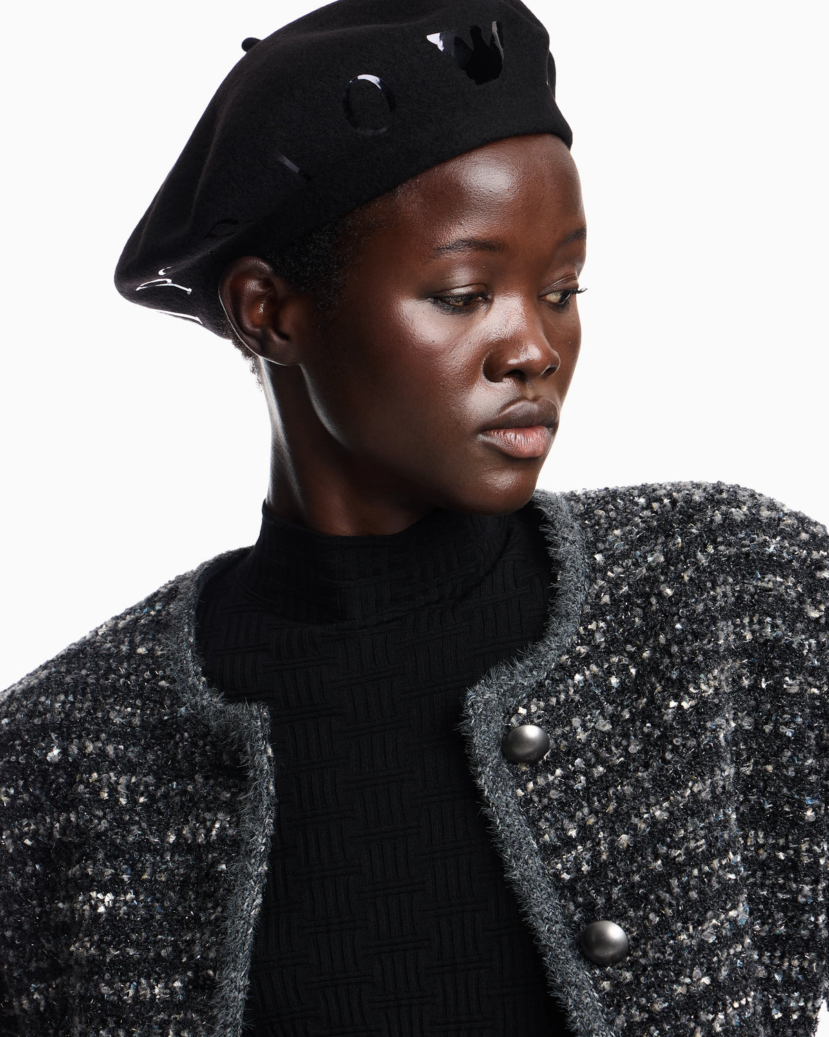 Beret hat with metallic studs around the edge