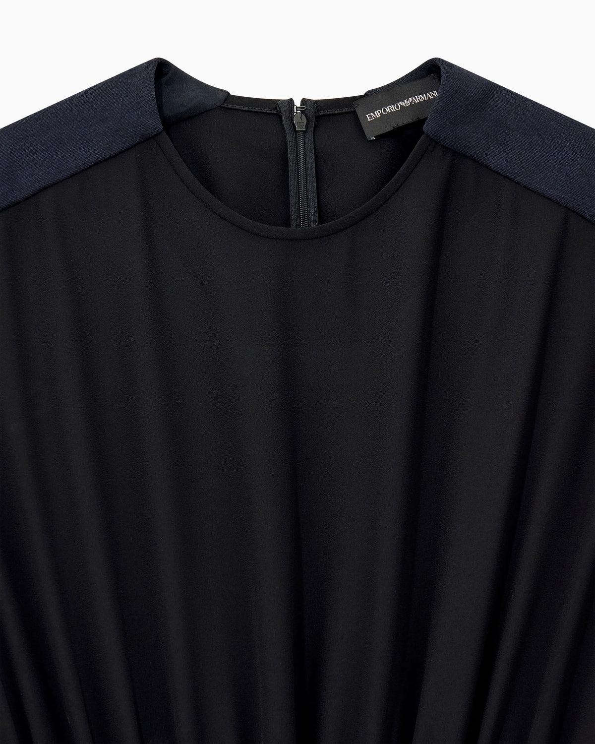 Sleeveless dress with a gathered bodice and front pleat