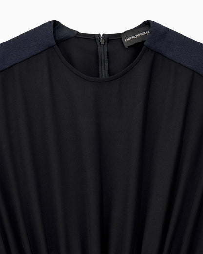 Sleeveless dress with a gathered bodice and front pleat