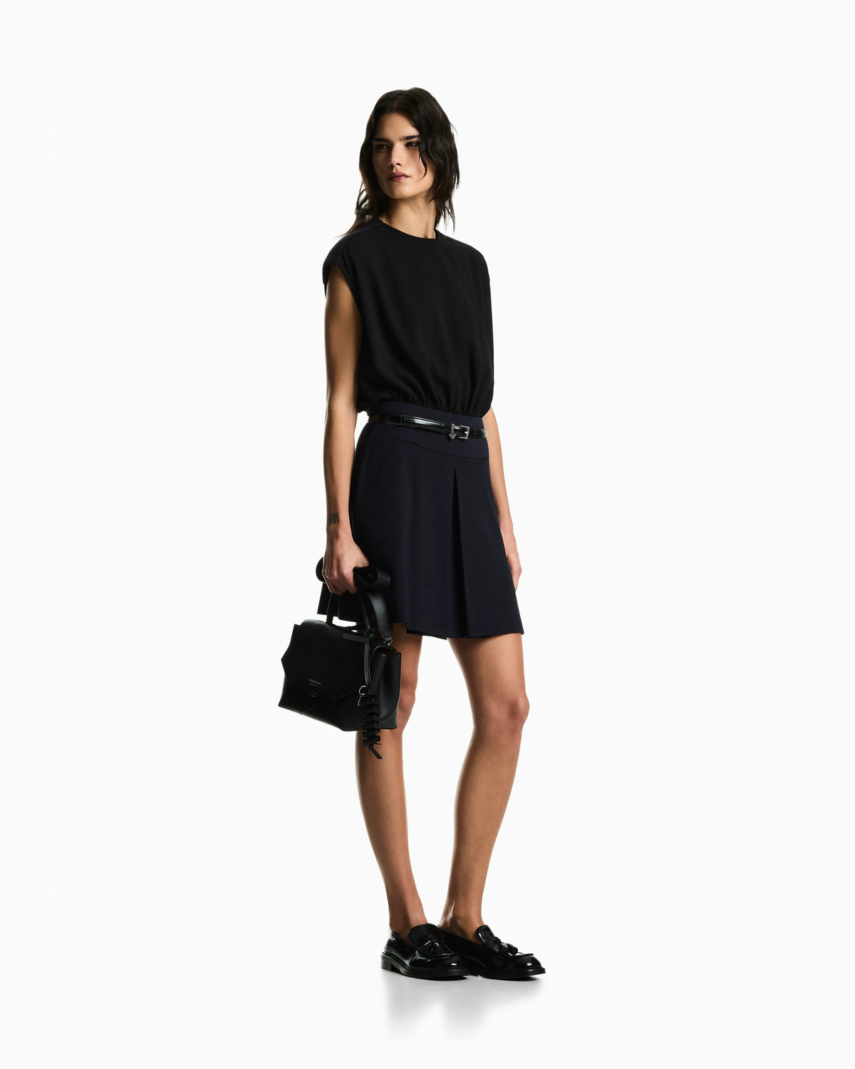 Sleeveless dress with a gathered bodice and front pleat