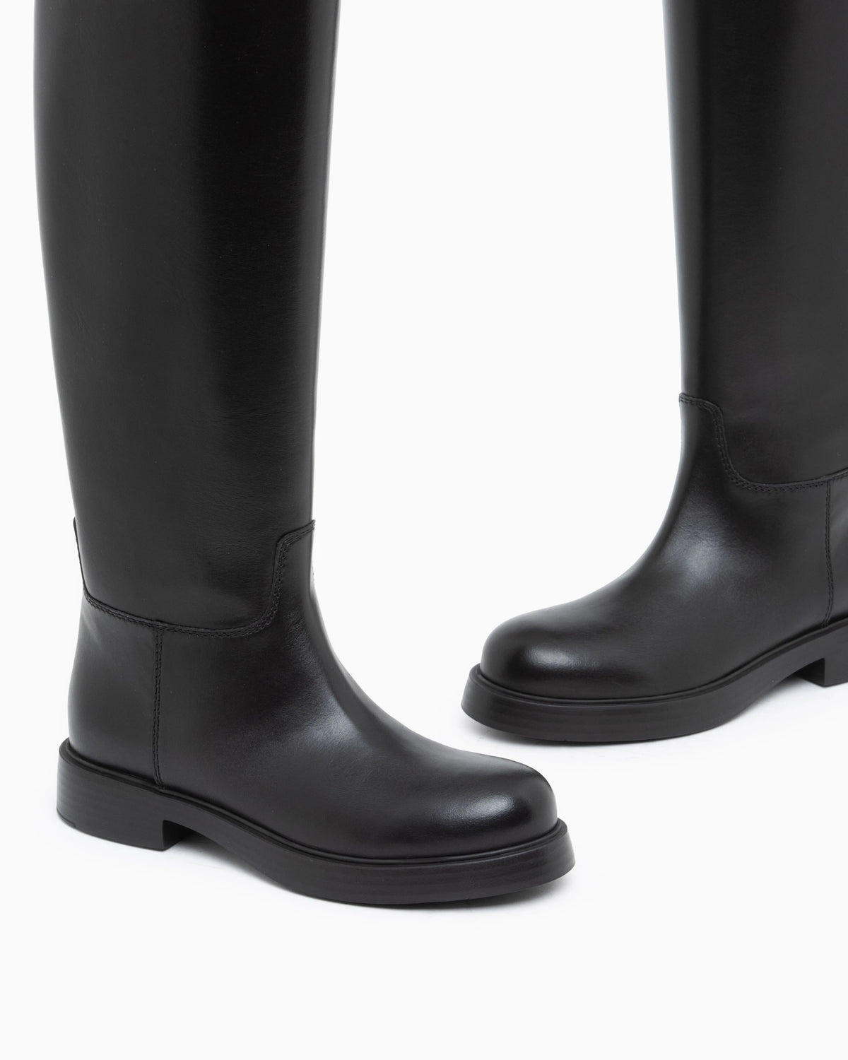 Leather knee-high boots with a round toe and low heel