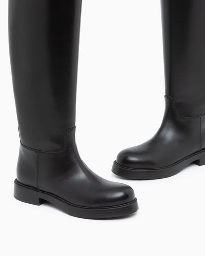 Leather knee-high boots with a round toe and low heel