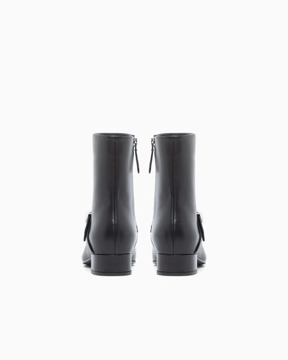 Nappa leather ankle boots with a side zip and metal buckle