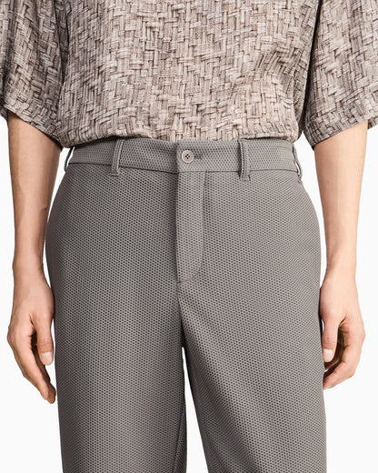 Flat front trousers in a technical gaufré honeycomb fabric