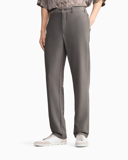Flat front trousers in a technical gaufré honeycomb fabric