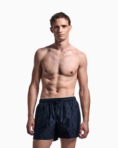 Monogram swim trunks