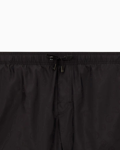Monogram swim trunks