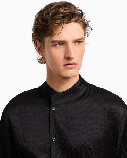 Giorgio’s satin shirt with a rhinestone detail