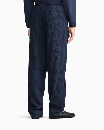 Flat front trousers in Lyocell and silk froissé