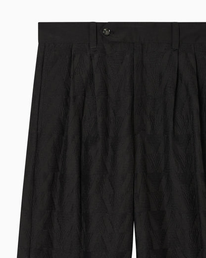 Trousers in linen blend fabric with pleats and chevron embroidery
