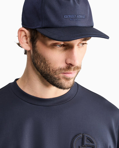 Technical fabric baseball cap with leather logo