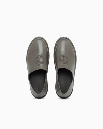 Slipper in leather with a rubber sole