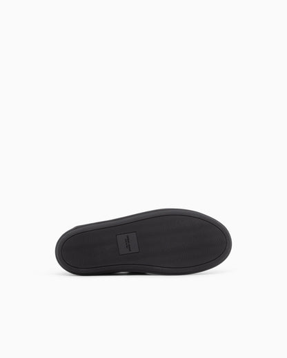 Slipper in leather with a rubber sole