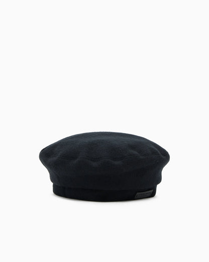 Knitted beret in cashmere with leather patch