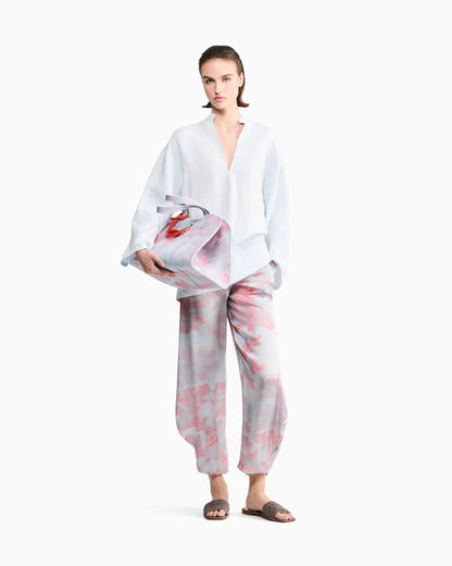 Rounded hem trousers in coral print silk