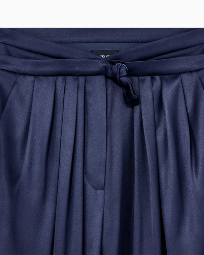 Multi-pleated trousers in silk satin with a waistband knot