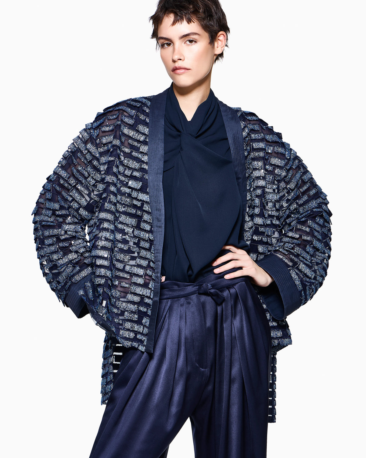 Multi-pleated trousers in silk satin with a waistband knot