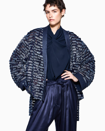 Multi-pleated trousers in silk satin with a waistband knot
