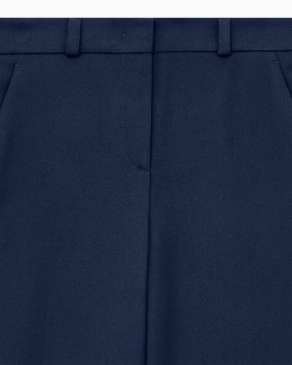Flat front tuxedo wool trousers with a hidden side pleat