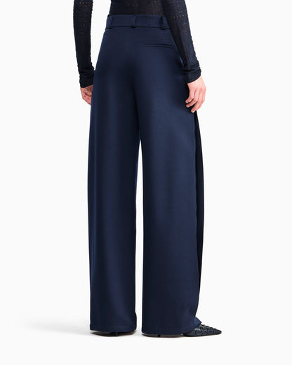 Flat front tuxedo wool trousers with a hidden side pleat
