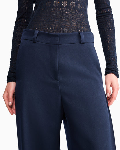 Flat front tuxedo wool trousers with a hidden side pleat