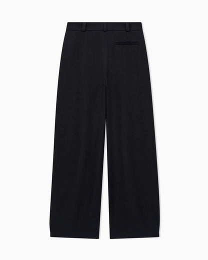 Flat front tuxedo wool trousers with a hidden side pleat