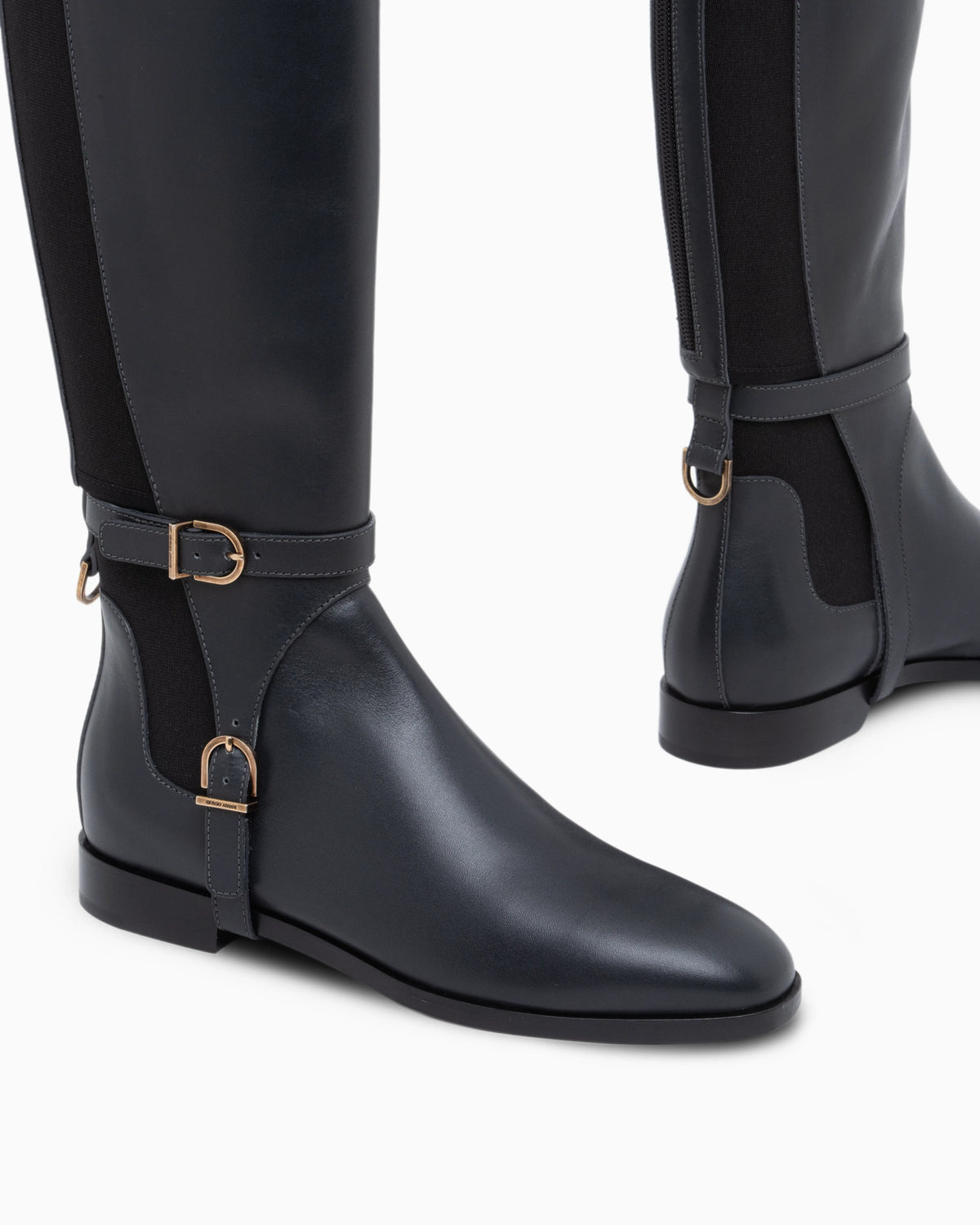 Boots in leather with rubber details