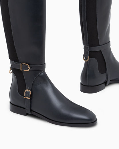 Boots in leather with rubber details