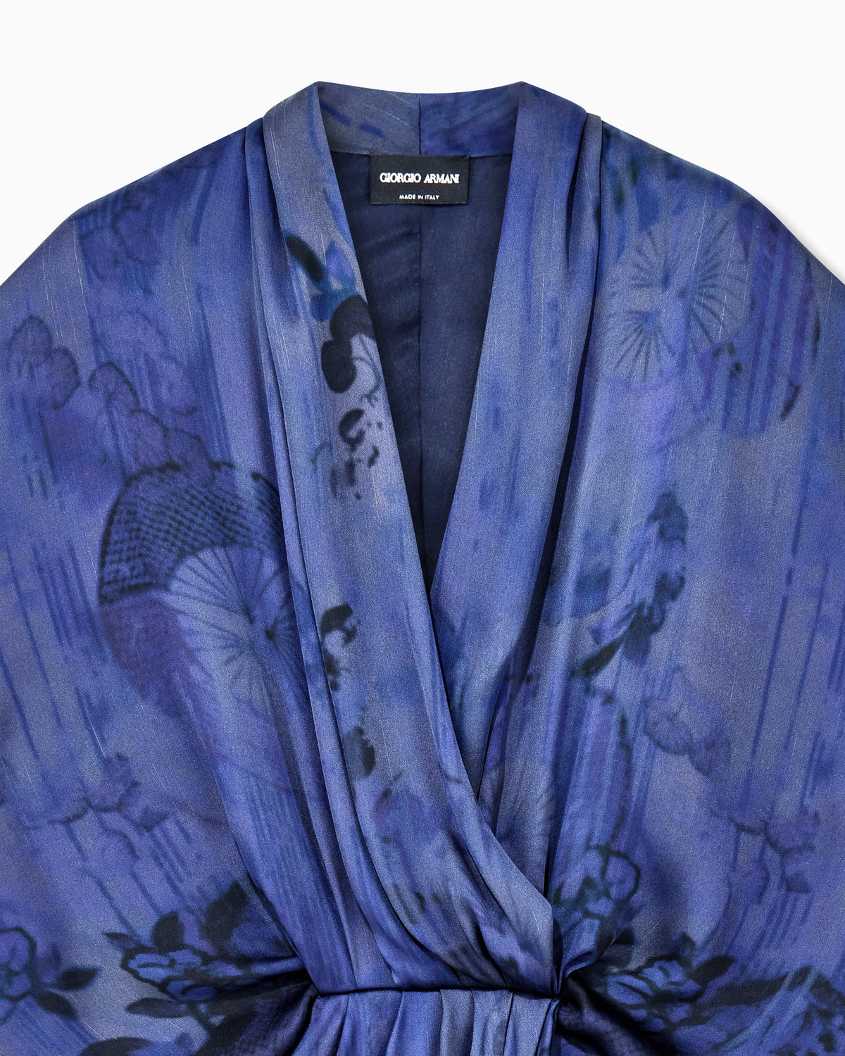 Draped silk dress with deep neckline and batik flower print