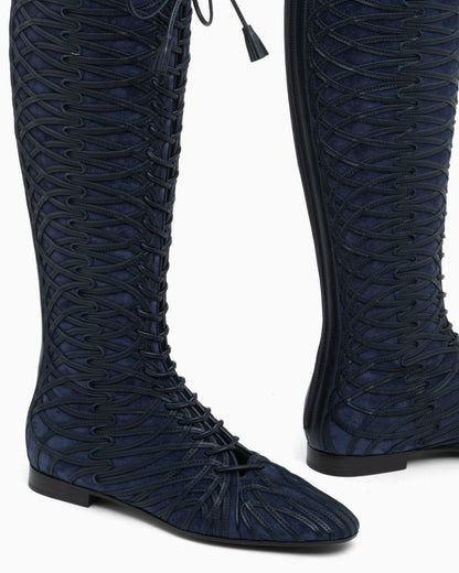 Boots in split leather with a leather sole