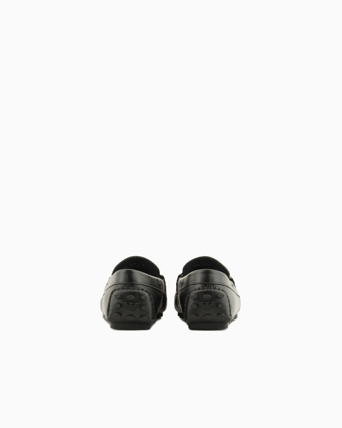 Stirrup bar loafer in pebbled leather with a studded sole