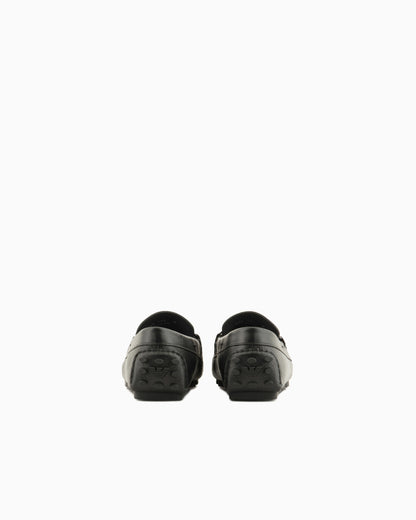 Stirrup bar loafer in pebbled leather with a studded sole
