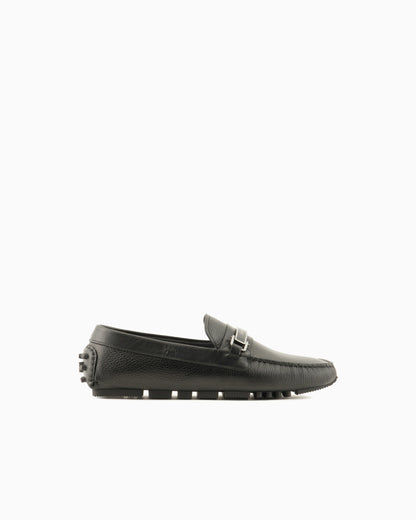 Stirrup bar loafer in pebbled leather with a studded sole