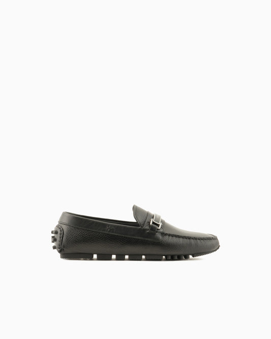Stirrup bar loafer in pebbled leather with a studded sole