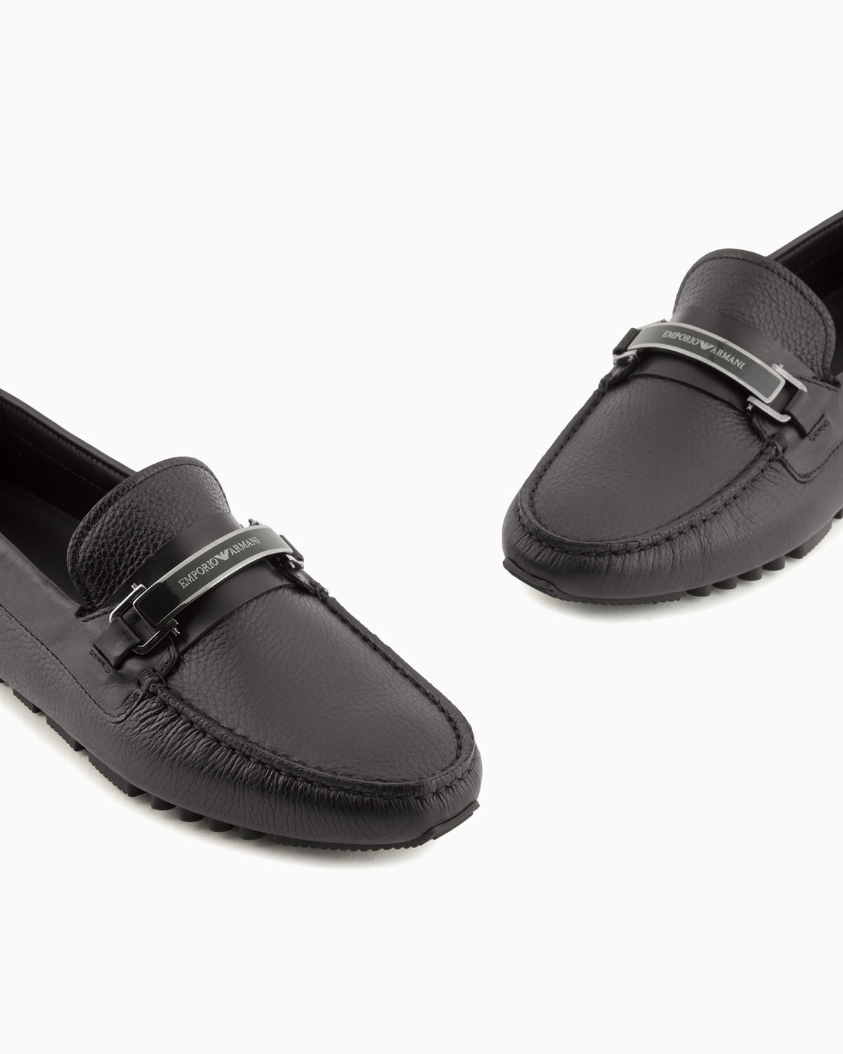 Stirrup bar loafer in pebbled leather with a studded sole