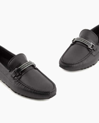 Stirrup bar loafer in pebbled leather with a studded sole