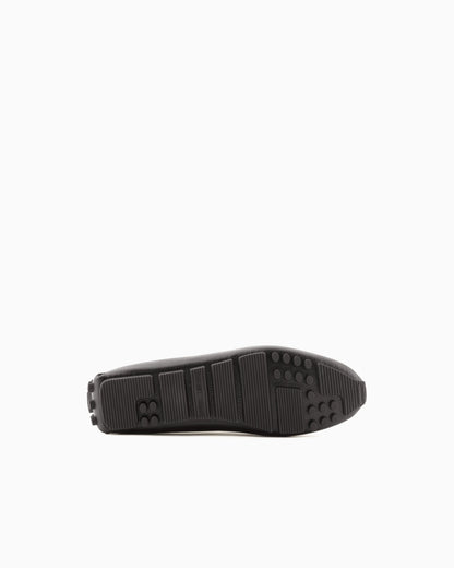 Stirrup bar loafer in pebbled leather with a studded sole