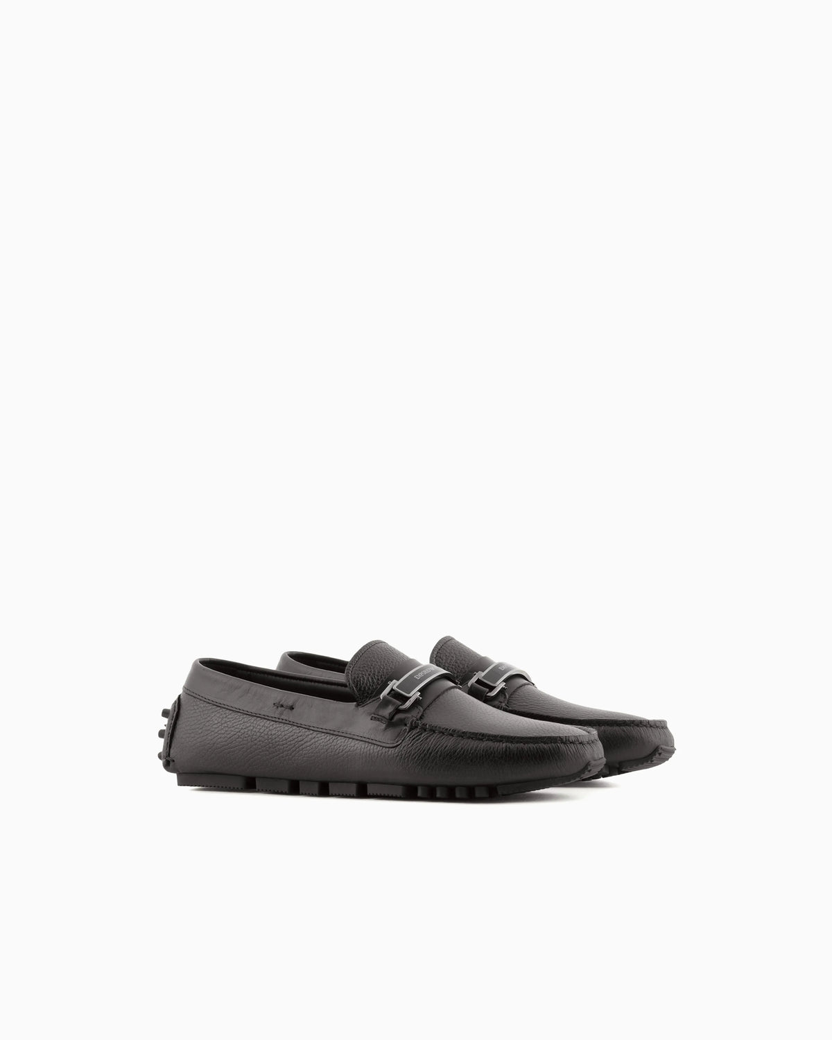 Stirrup bar loafer in pebbled leather with a studded sole