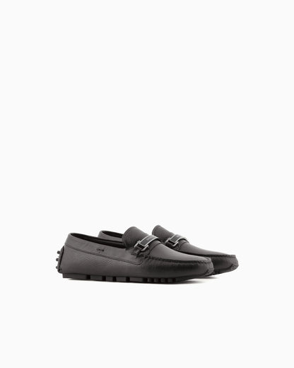Stirrup bar loafer in pebbled leather with a studded sole
